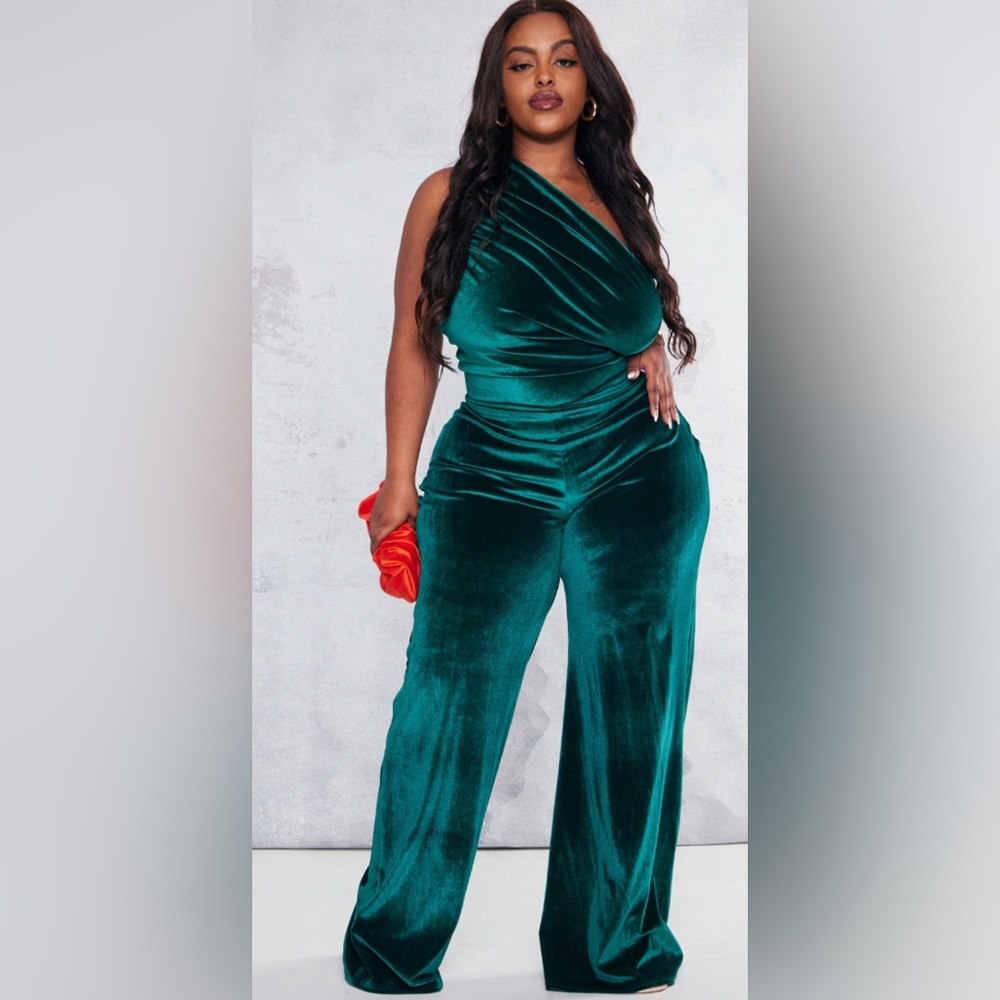 emerald green velvet material with a one-shoulder design jumpsuit